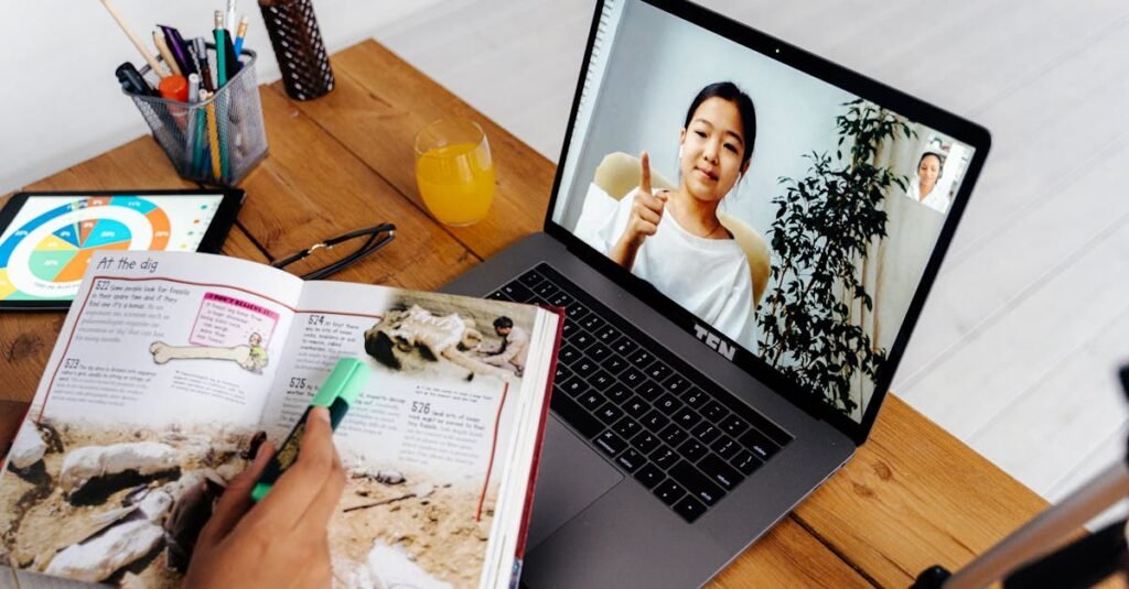 Online teaching session with digital tools, featuring a woman on a laptop screen and educational materials.